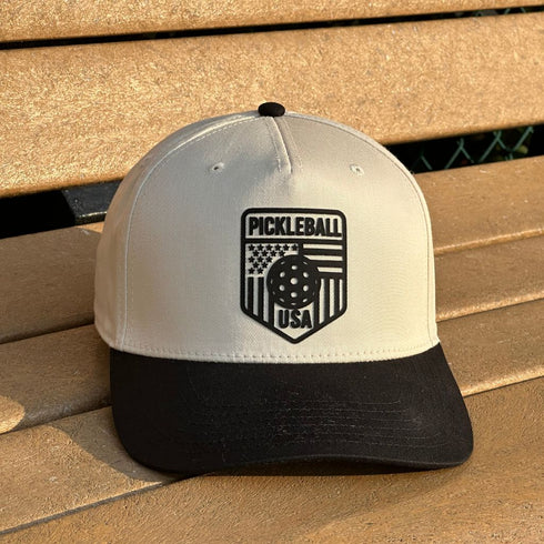 Pickleball USA cap on a wooden surface